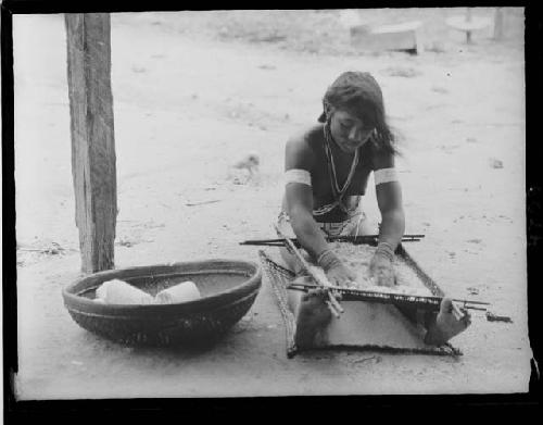 Girl sifting cassava