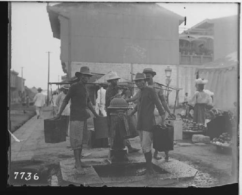 Men Collecting Water