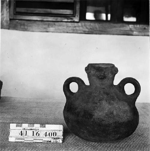 Small Pottery Jar with Face on Neck of Vessel