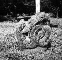 Sculptured stone serpent head