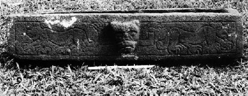 Sculptured stone trough with jaguar sculpture