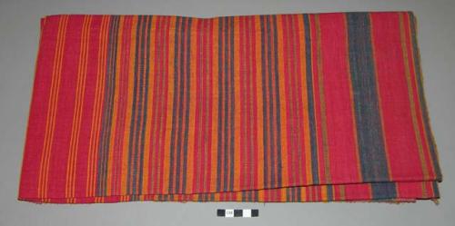 Cloth; cotton; red, gold, blue.