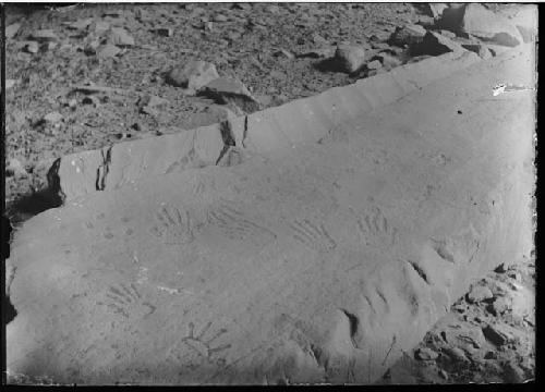 Pecked handprints -- burial cave near ruin A