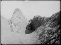 Narrow passage between Bandelier group and Uhle group. In background is Hill of the Dead and White Hill