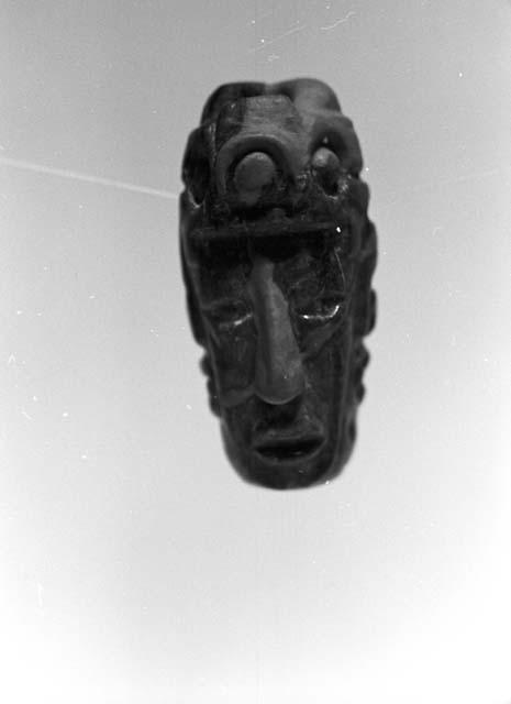 Fragment of bead or pendant, human head