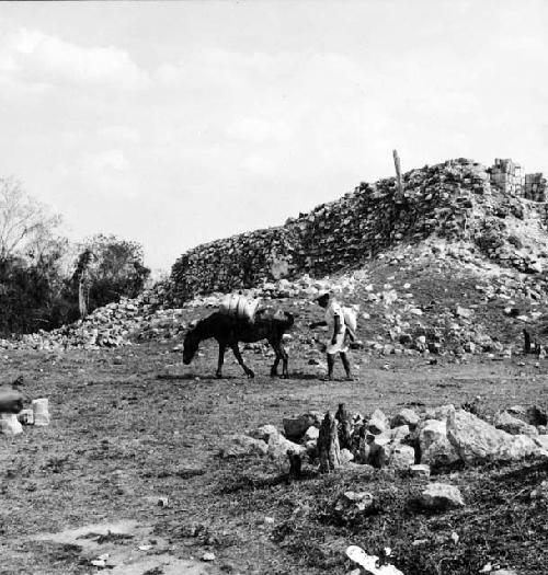 Man and mule walking through Chichen Viejo