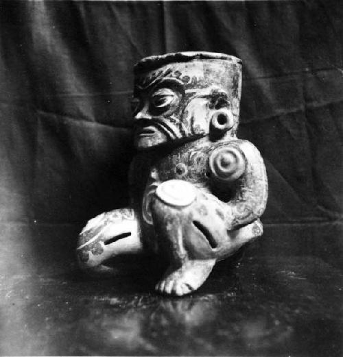 Kneeling human effigy figure