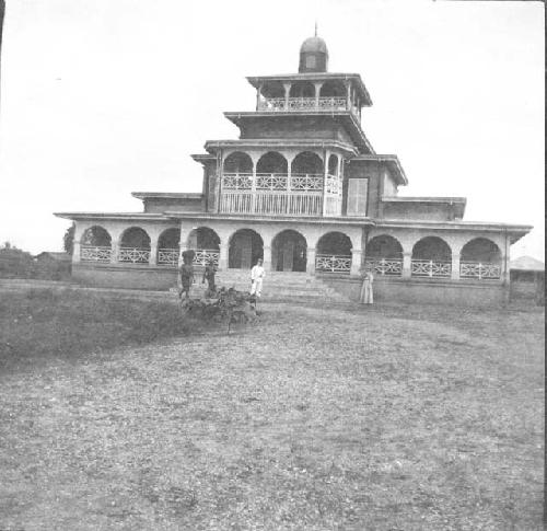 People in front of palace