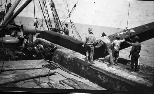 Men working on a ship