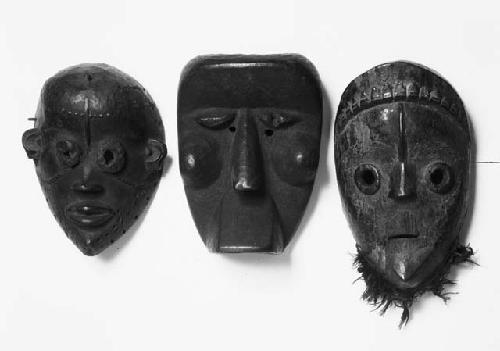 Three wooden masks