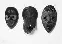 Three wooden masks