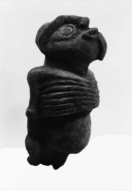 Human figure in clay or soft stone, painted red