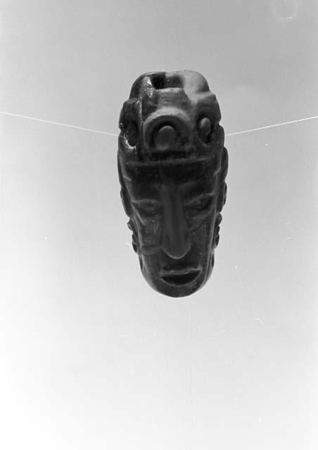 Fragment of bead or pendant, human head