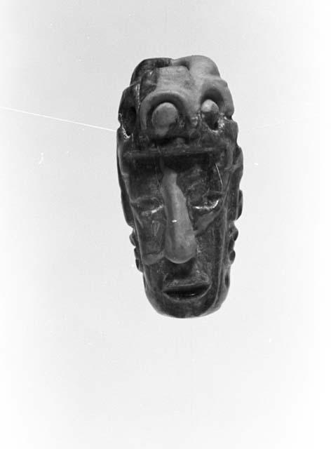 Fragment of bead or pendant, human head