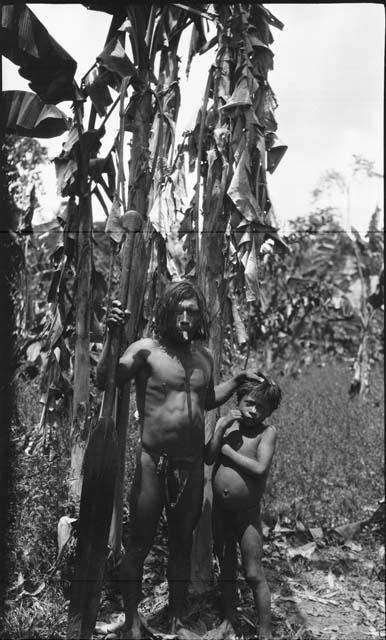 Man standing with young boy