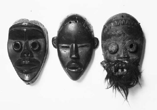 Three wooden masks