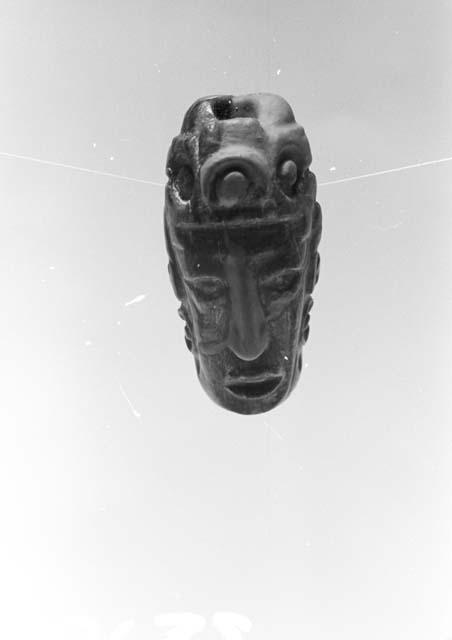 Fragment of bead or pendant, human head