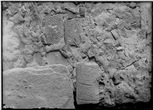 Incised stone in wall of room in ruin 8