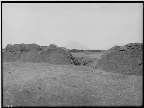 Part of southwest wall within the ruins of Tschudi group; background is Bell Hill