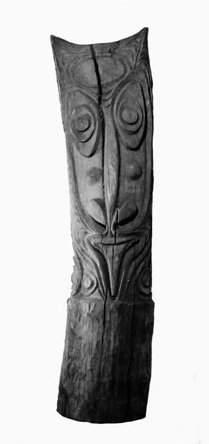 Carved wooden house post