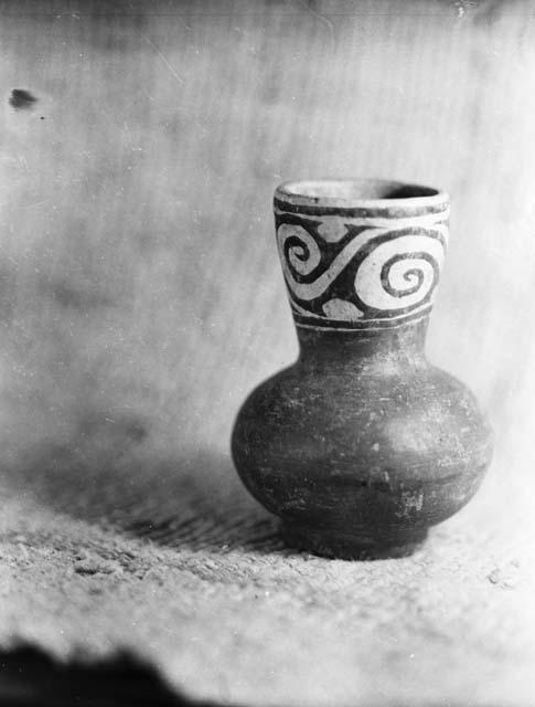 Red carafe with polychrome neck ring base, grave 6, lower level, number 92