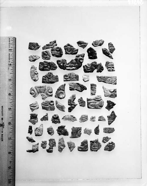 Fragment of jade faces and headdresses