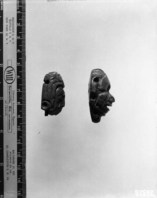 Sides of two carved jade fragments