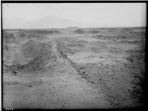 Ruin embraced in eastern angle of Velarde group. Background is Bandalier Group, Huacas of Toledo, and forgotten Huaca. Further back is Trujillo and Hill of the Dead.