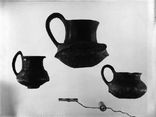 3 black ware vessels - 2 handled cups