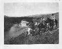 "The Piegan," photograph of Native Americans on horses by river