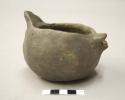 Vessel with spout and missing handle