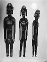Carved wooden human figures - male