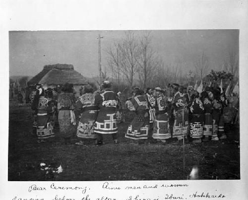 Bear ceremony, Ainu men and women dancing before altar