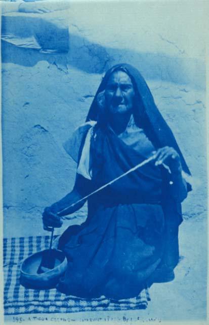 Tigua woman making thread, Isleta