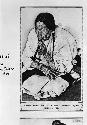 Blackfeet woman smoking a pipe