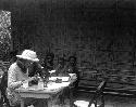 Cora du Bois sitting at typewriter, Alor, Netherlands East Indian (Indonesia) 1939