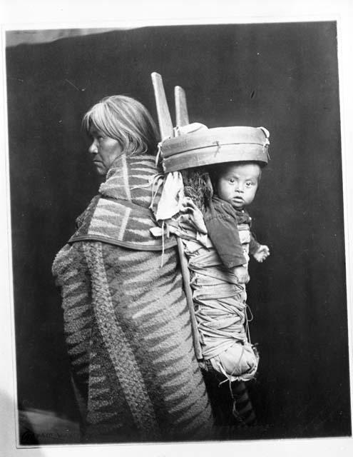 Navajo Indian woman with baby in cradleboard