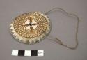 Breast ornament, etched edge of shell