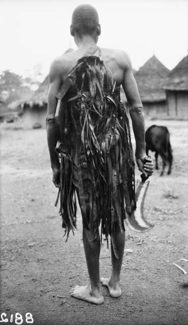 Tuabo clan, man dressed for war dance - rear view