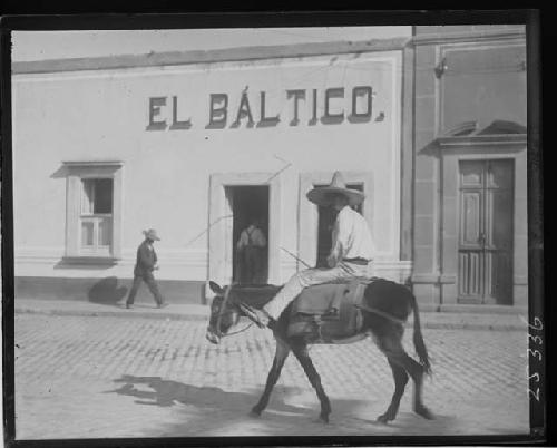 Man Riding Donkey