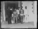 Group of men in front of building