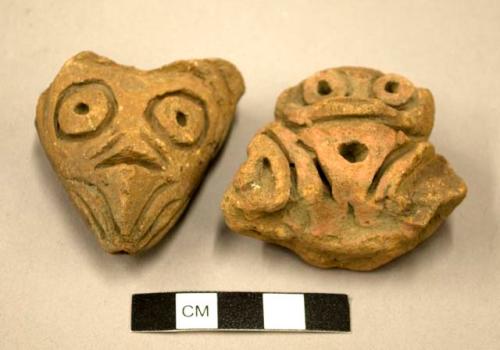 Pottery heads broken from vessels