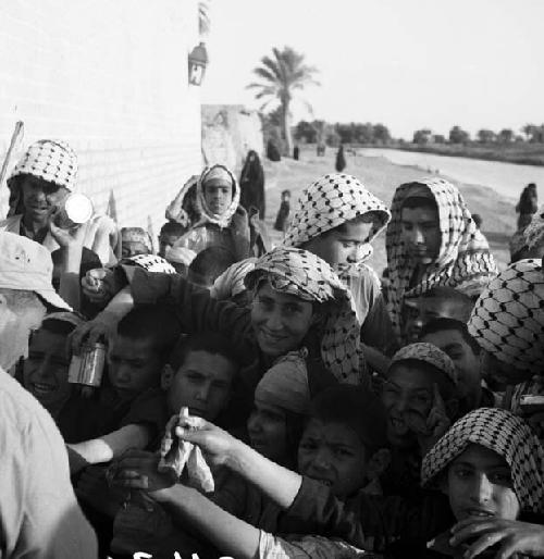 Yusuf Lozar buying lizards from children in Afag