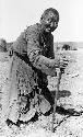 Old woman leaning on cane