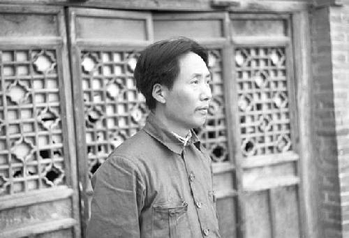 Portrait of Mao Zedong. Wall in background