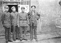 Bo Gu, Zhon Enlai, Zhu De and Mao Zedong standing in front of doorway