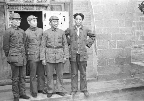 Bo Gu, Zhon Enlai, Zhu De and Mao Zedong standing in front of doorway