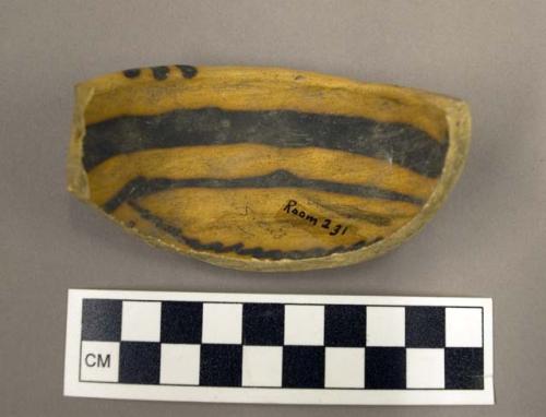 Half of Jeddito black-on-yellow pottery bowl