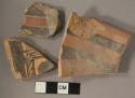 3 black-on-orange potsherds