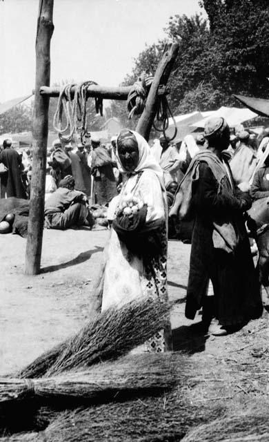 In the open square of a marketplace on bazaar day